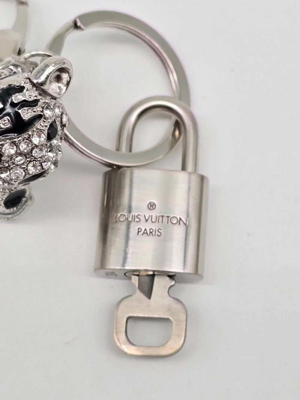 Authentic Louis Vuitton Silver Padlock with Unbranded Silver Tiger Bagcharm